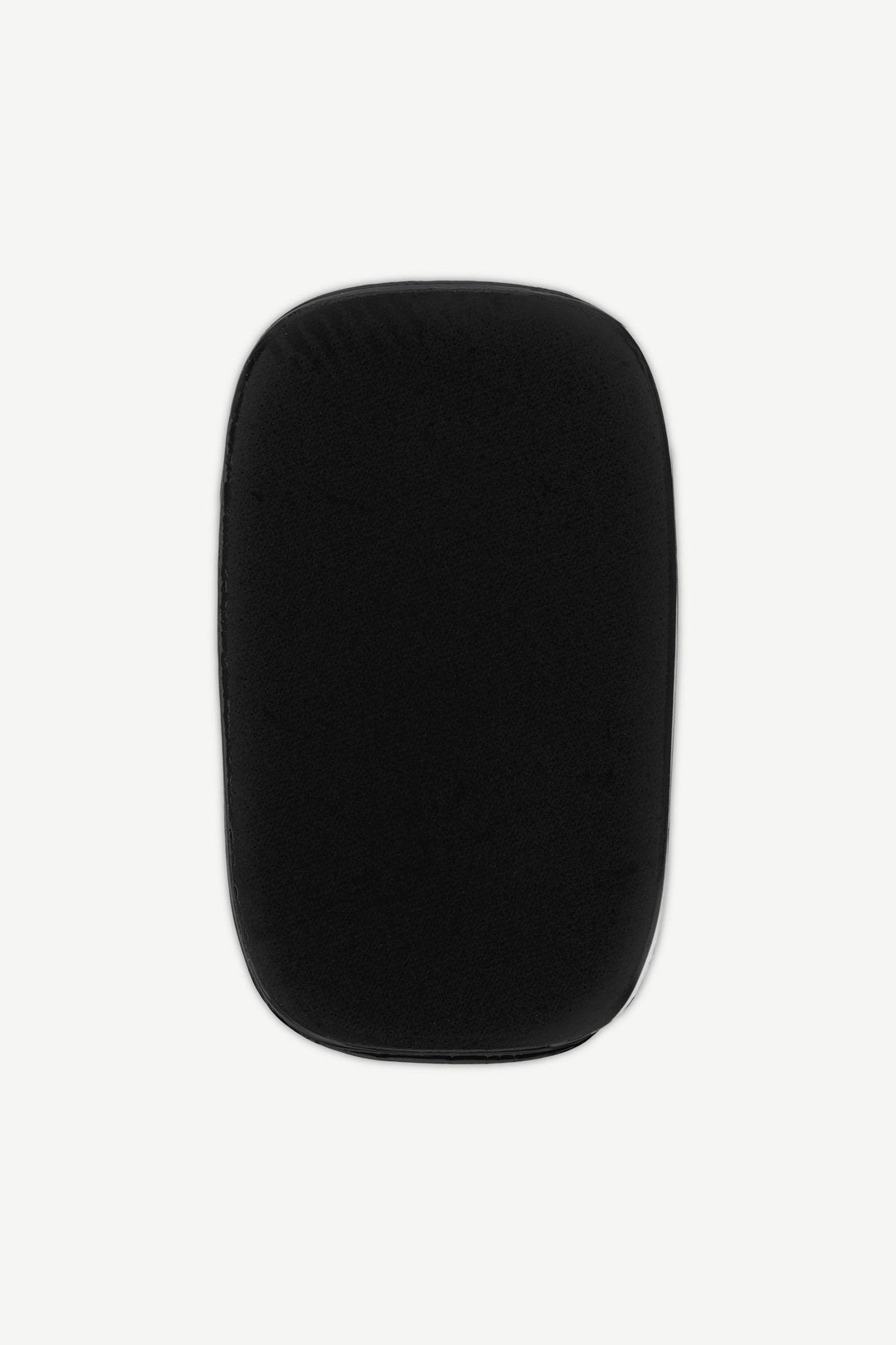 Black stick-on gel nail with matte finish and even surface texture, shown on white background.