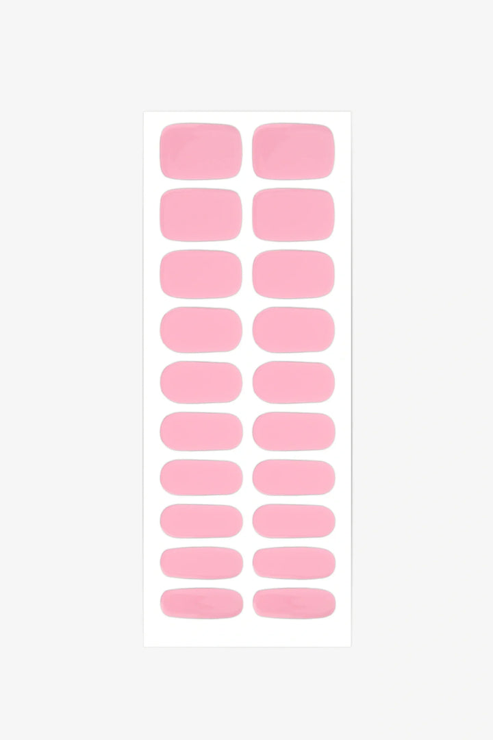 Sheet of semi-cured gel nail wraps in vibrant Barbiecore pink tones with a smooth, glossy surface.