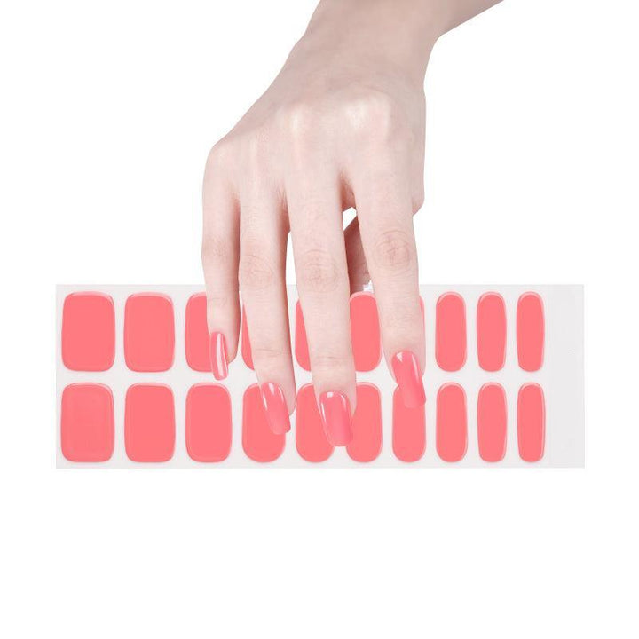 Bright coral gel nail wrap sheet displayed on a white surface.