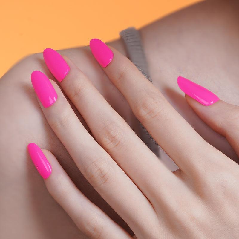 Neon bright pink gel nail wraps with high-gloss finish on light skin tone.