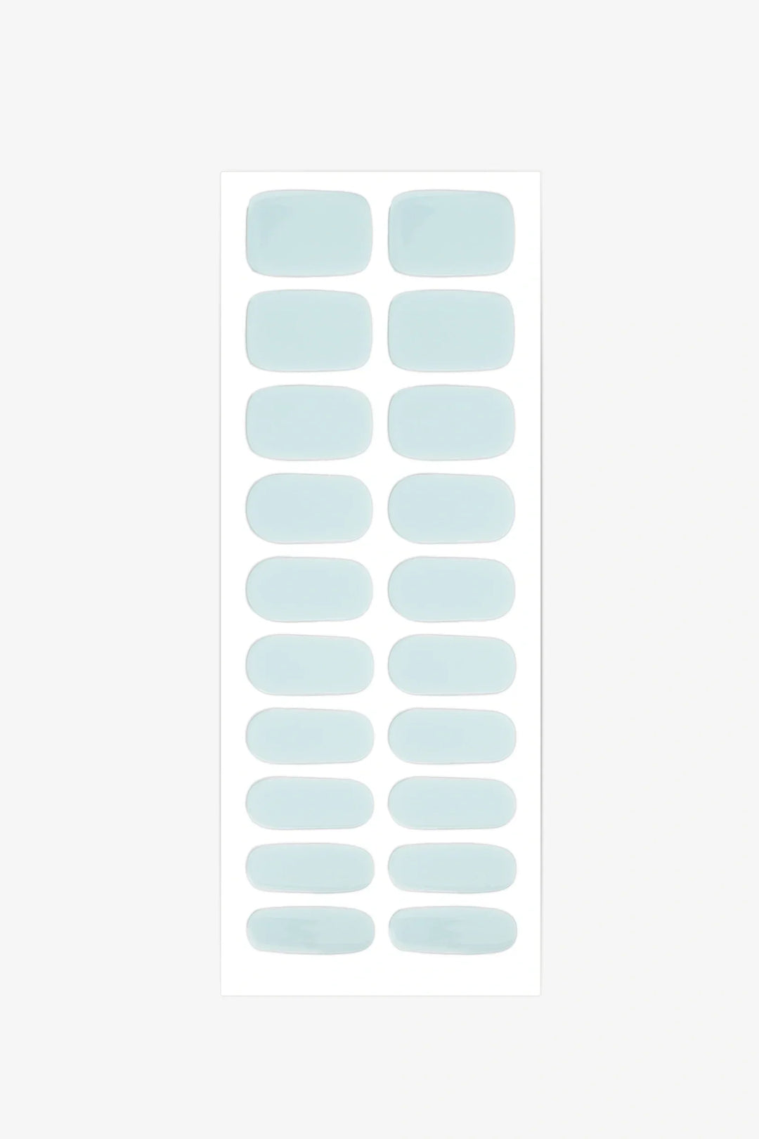 Sheet of semi-cured gel nail wraps in pale sea-foam teal shades with a smooth, high-gloss surface