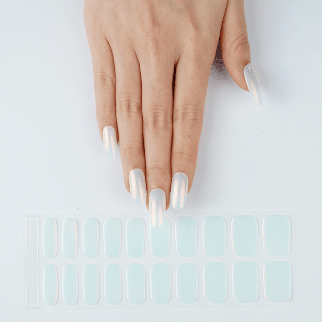 A full set of mint chrome gel nail strips with subtle silver shimmer on pale base.