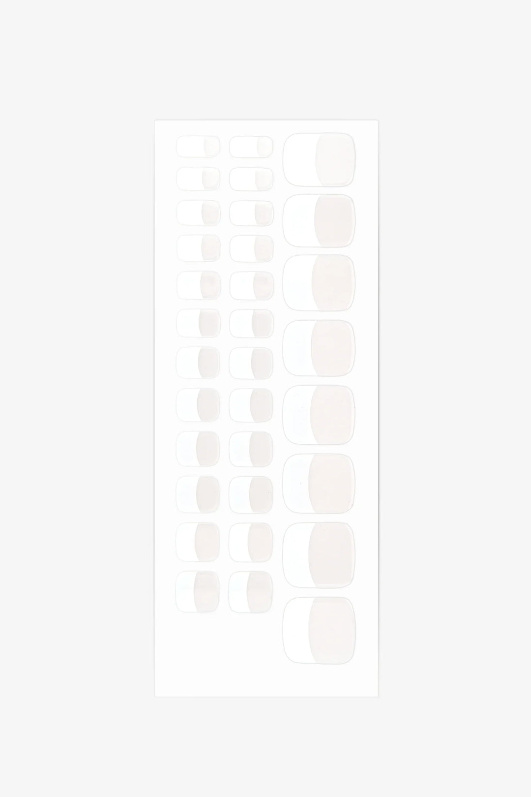 Sheet of French gel toenail wraps featuring sheer nude base and bright white tips with glossy finish.