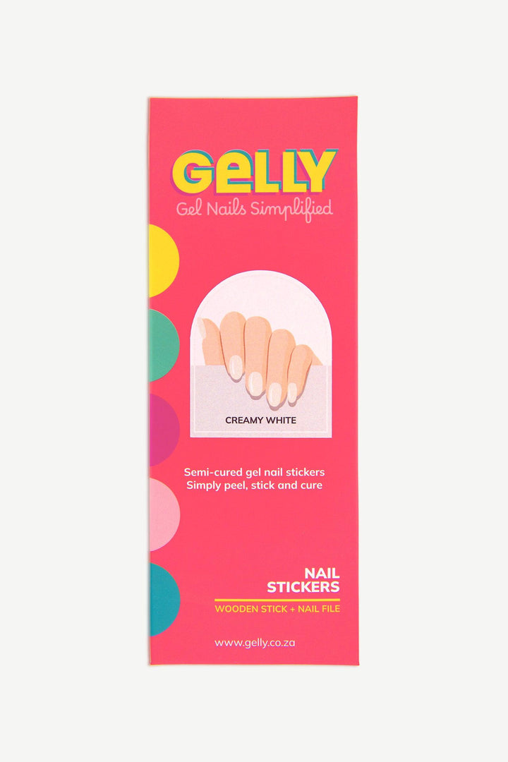 Packaging of Creamy White semi-cured gel nail strips in bright pink box with product sheet visible.