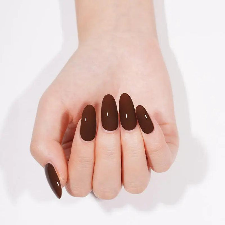 Espresso brown gel nail wraps with deep cocoa tone and high-gloss finish on light skin tone.