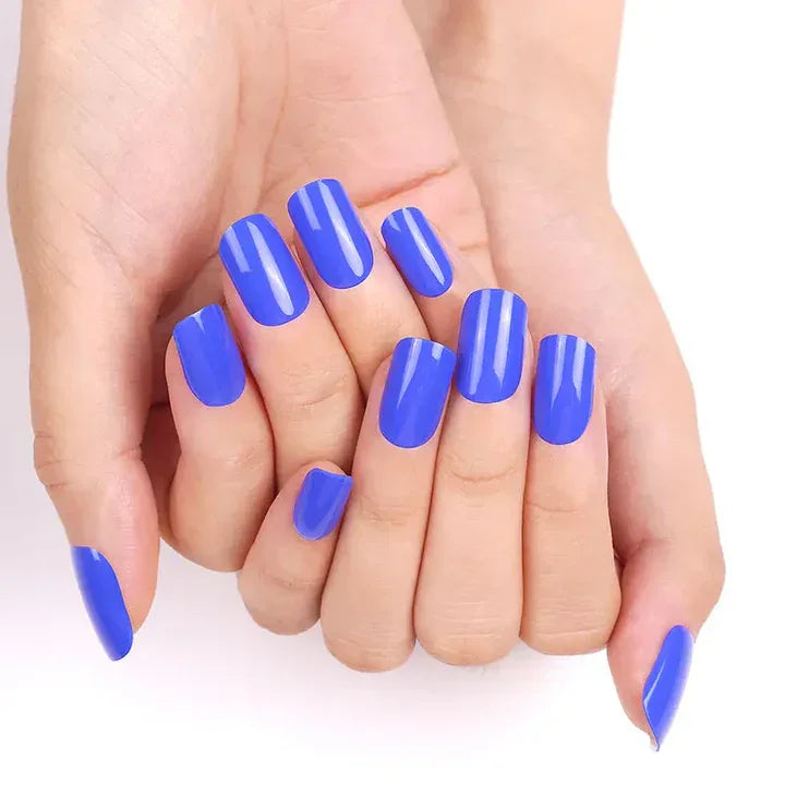 Bright royal blue gel nail wraps with mirror-like shine on light skin tone.