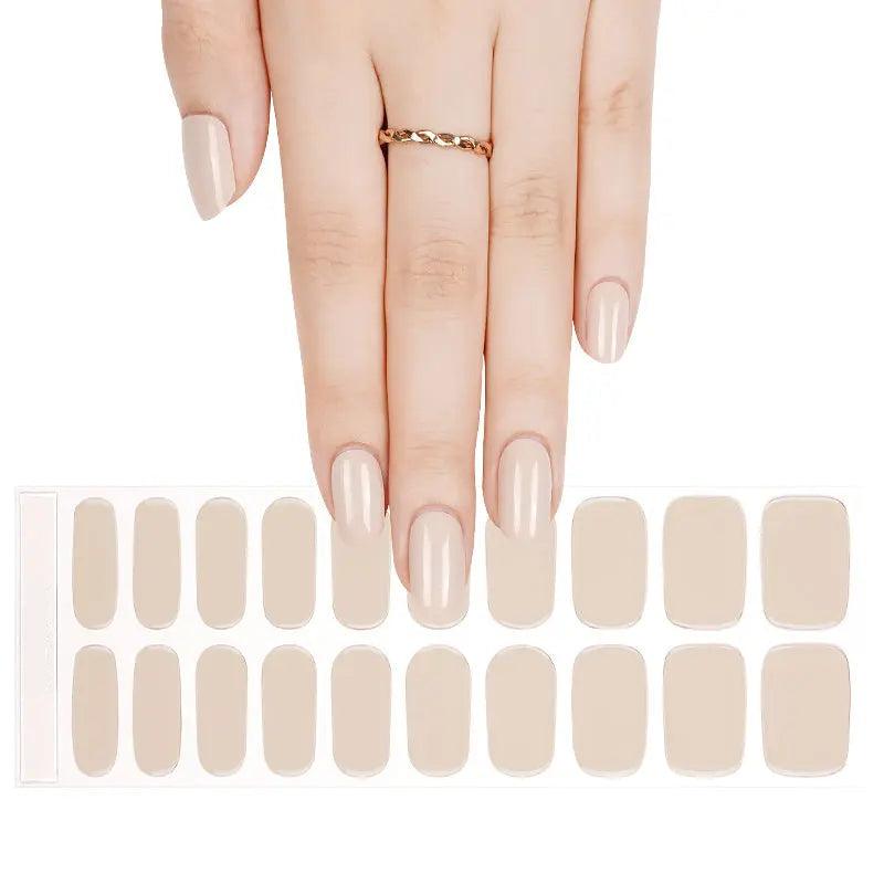 Sheet of ivory semi-cured gel nail wraps with creamy tone and high-gloss finish.