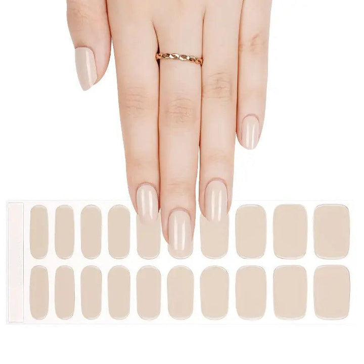 Sheet of ivory semi-cured gel nail wraps with creamy tone and high-gloss finish.