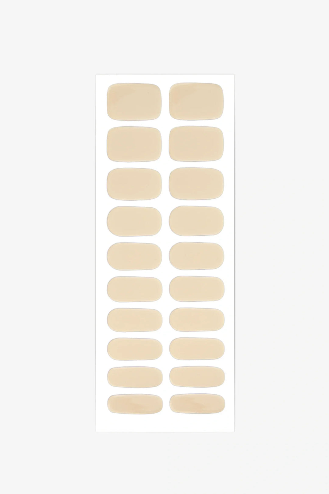 Sheet of semi-cured gel nail wraps in light pastel-yellow tones with a smooth, glossy finish.