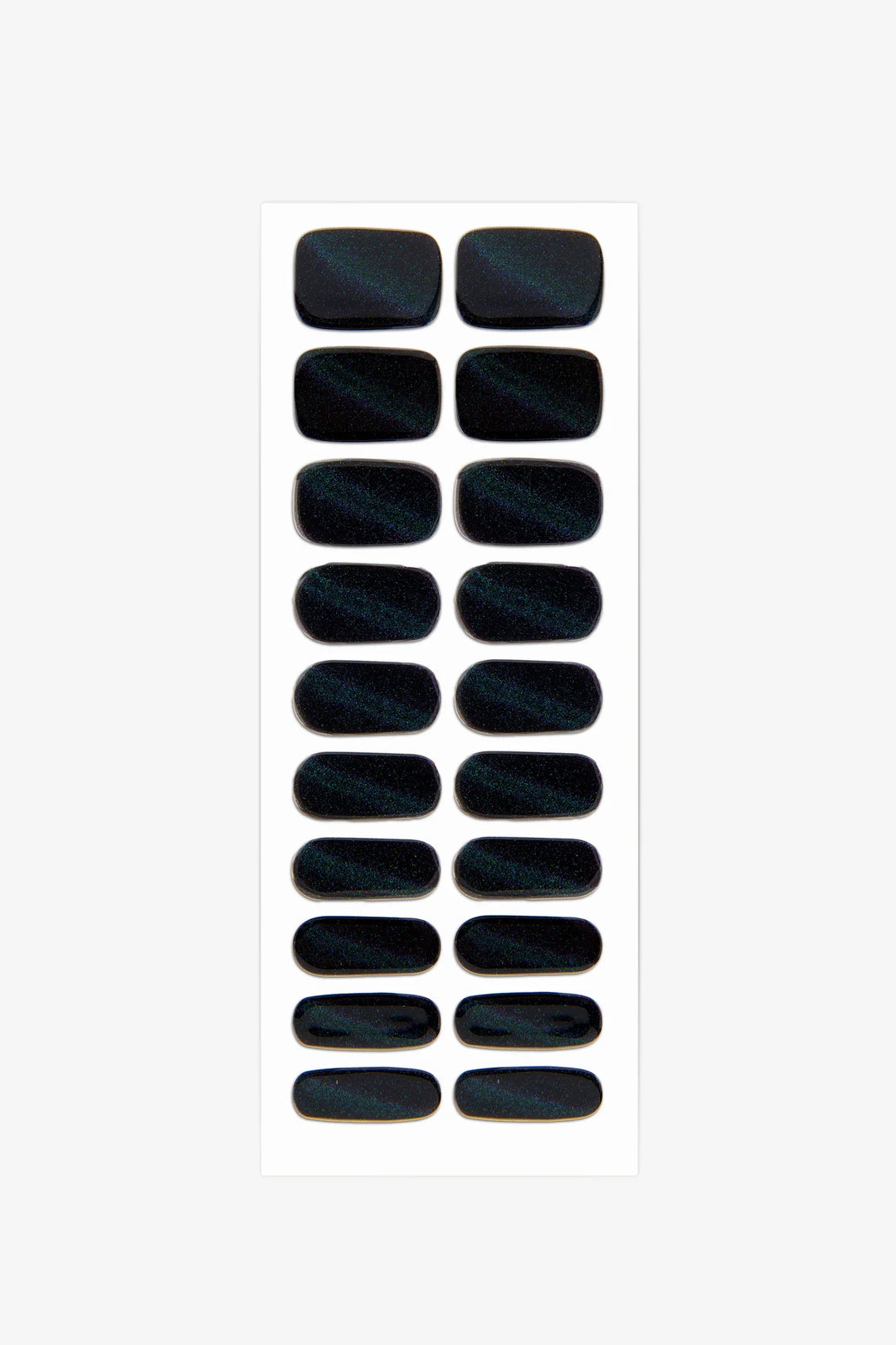 Sheet of slightly translucent black cat-eye gel nail wraps with rainbow shimmer and glossy magnetic finish.