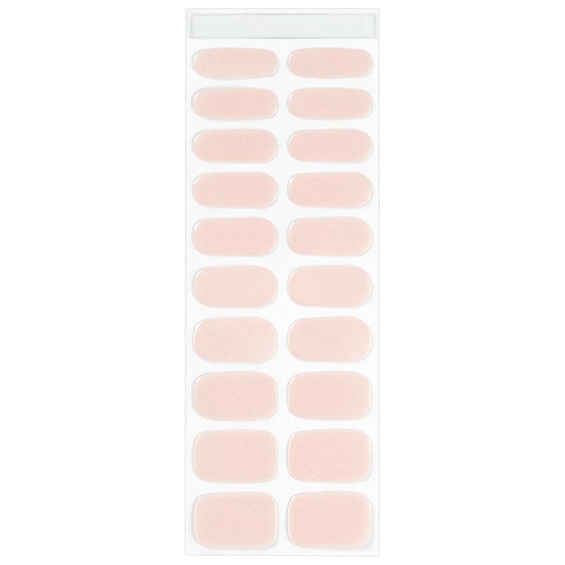 Sheet of natural beige gel nail strips with a blush nude tone and glossy finish.