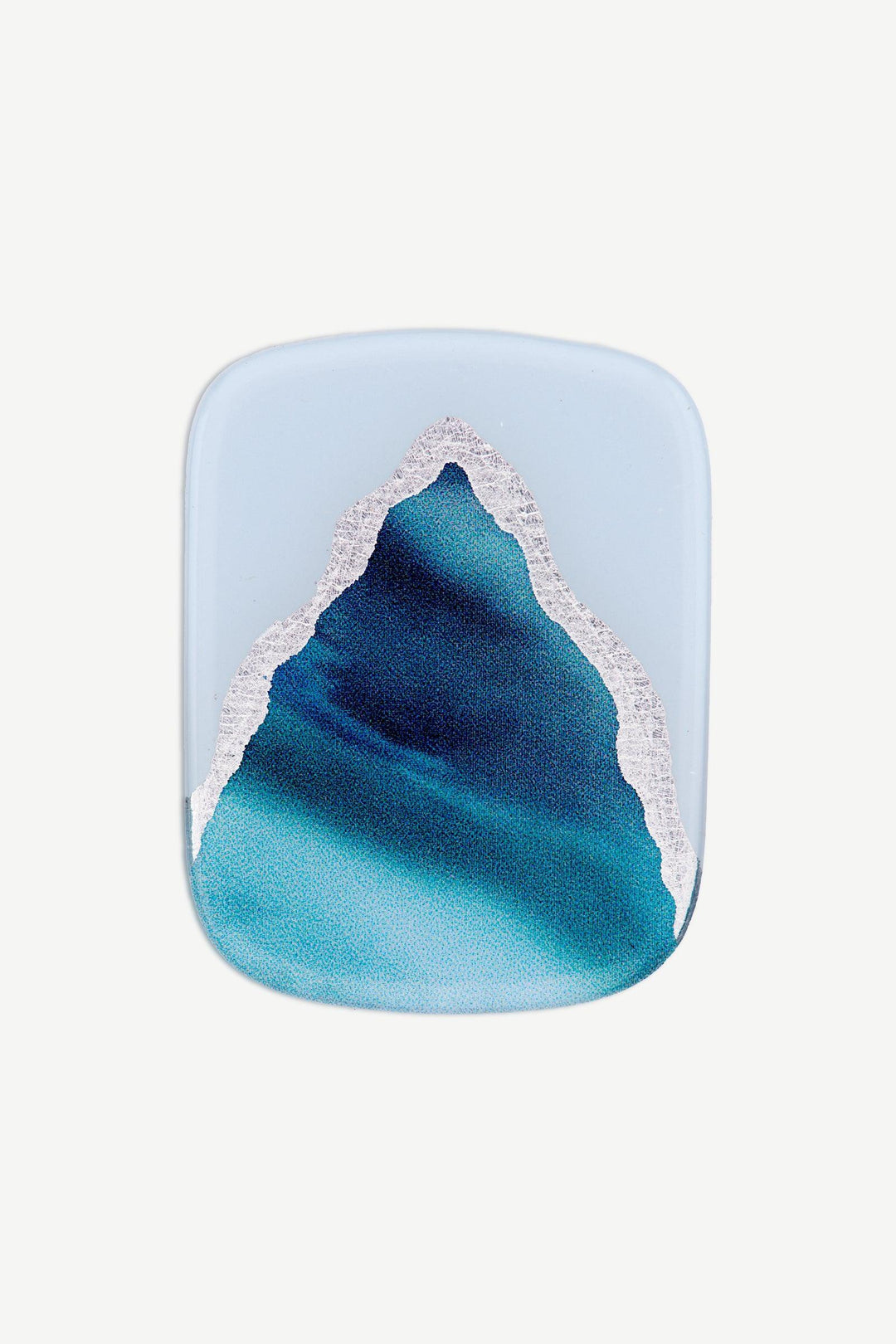 Macro image of an ocean blue marble gel toenail wrap with layered deep blue, aqua, and silver swirls.