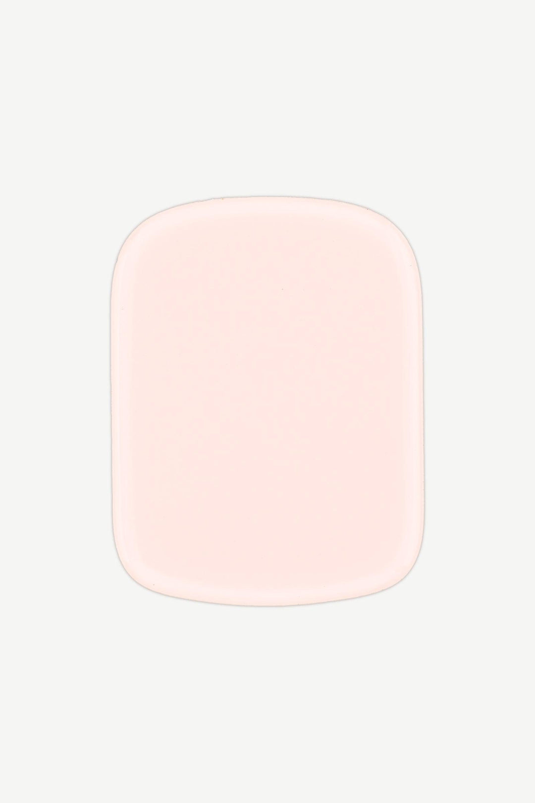 Close-up of a single creamy pastel pink stick-on gel nail with a high-gloss shine.