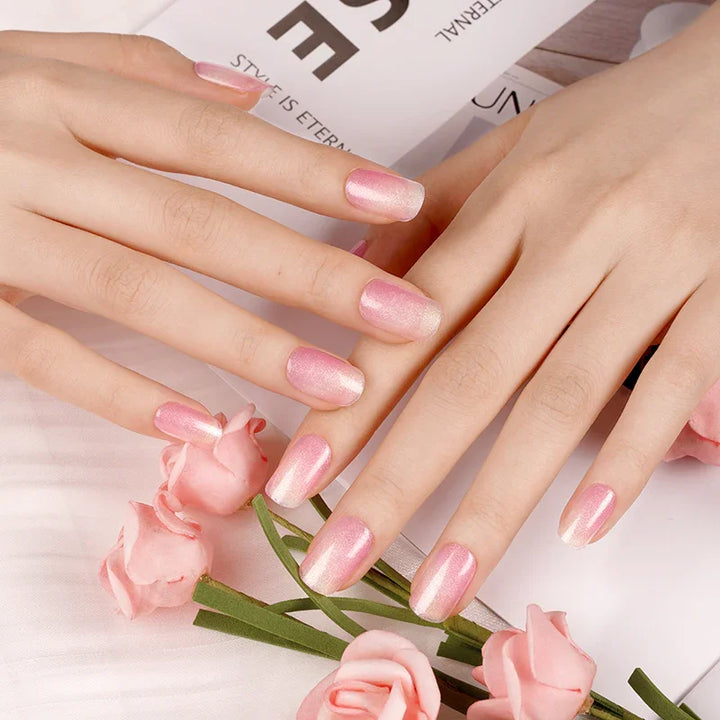Semi-cured gel nail wraps in sheer pink with a fine cat-eye shimmer and glossy finish, shown on fair skin.