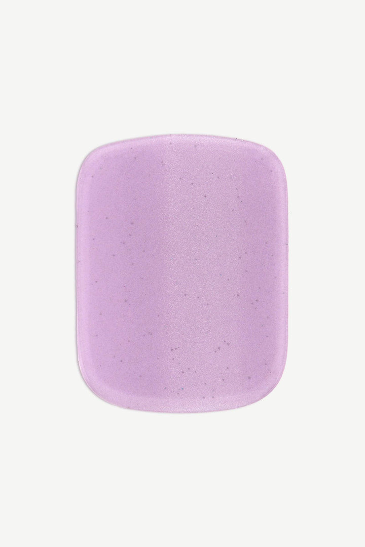 Close-up of lavender gel toenail strip showing soft cat-eye shimmer and glossy surface.