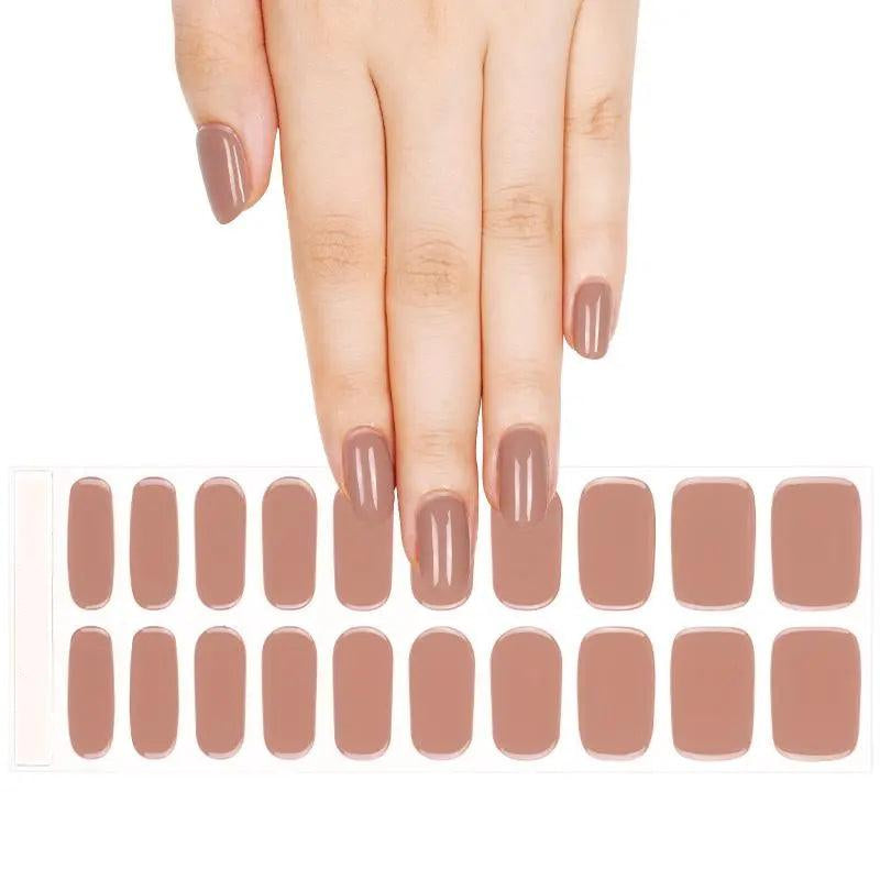 Sheet of taupe semi-cured gel nail wraps with warm brown-pink tone and high-gloss finish.