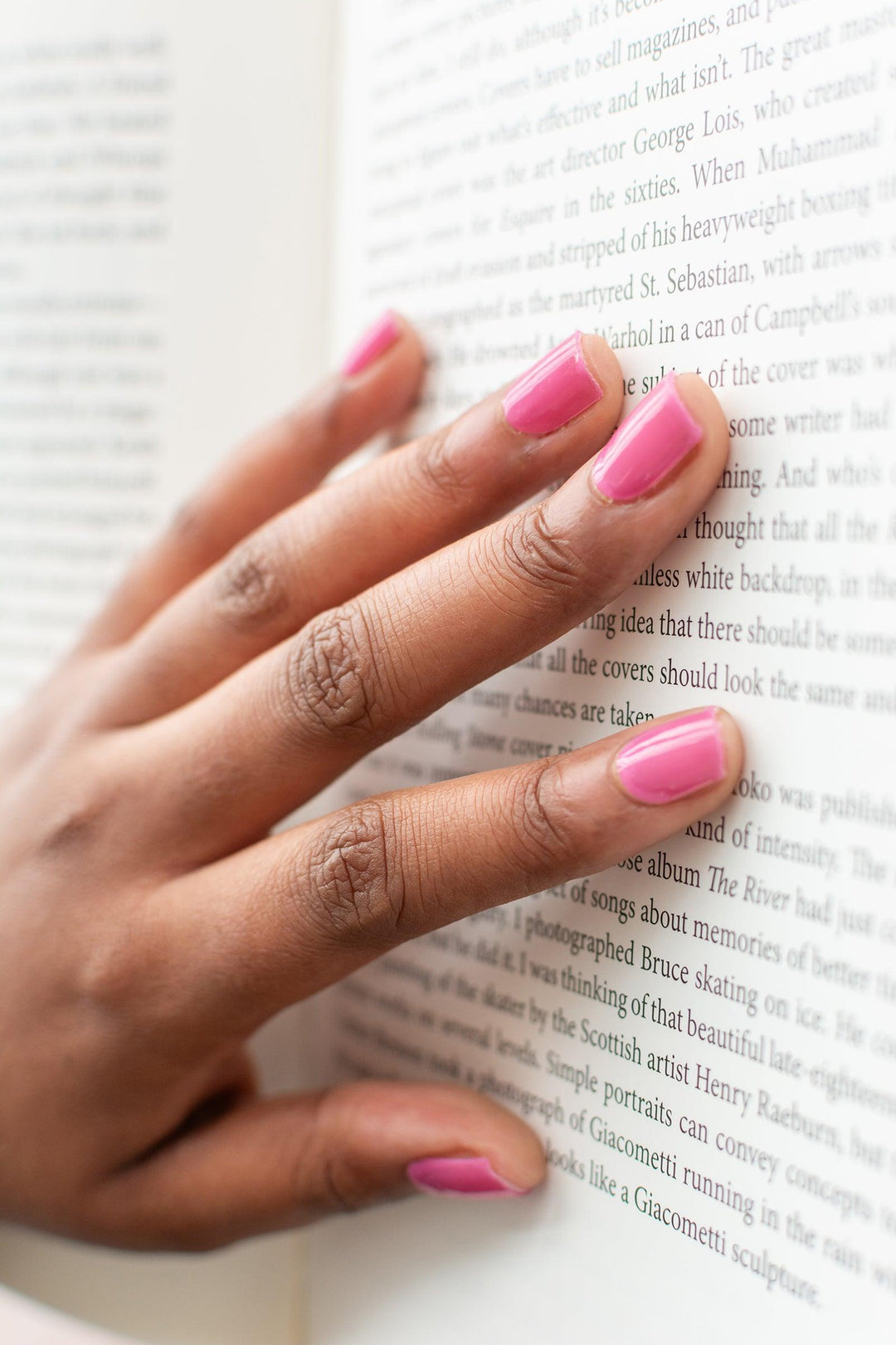 Translucent pink gel nail wraps with glossy finish on medium skin tone.