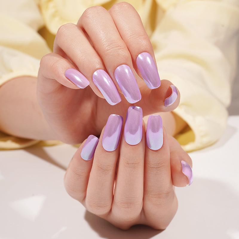 Lavender pearlescent gel nail wraps with lilac sheen on light skin tone, glossy and reflective under soft studio light.