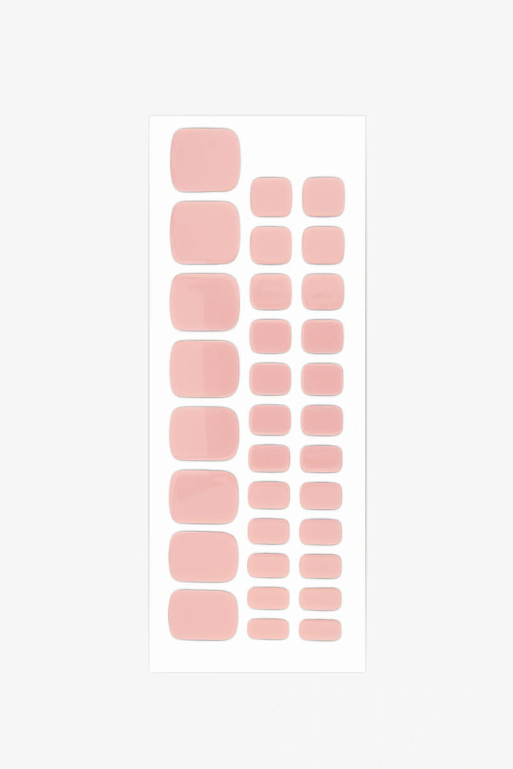 Full sheet of Barefoot gel toenail strips in a light peach nude shade, displayed in various sizes on a white background.