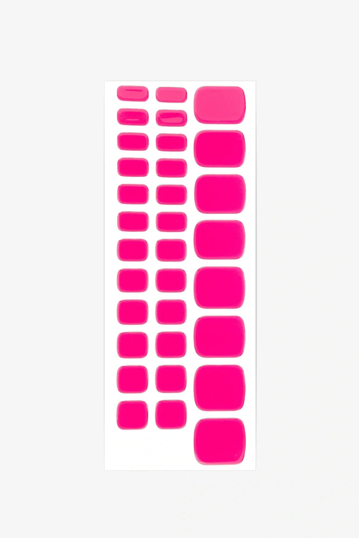 Sheet of bright pink gel toenail stickers in multiple sizes on a white backing.