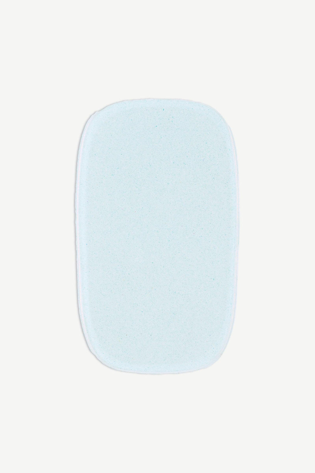 Macro image of an individual chrome mint gel nail strip with metallic pearl finish and translucent aqua undertone.