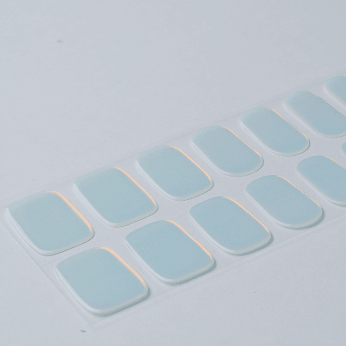 Sheet of chrome mint semi-cured gel nail wraps showing silver-green iridescent shine with smooth glossy surface.