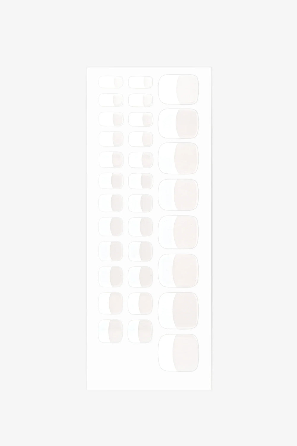 Sheet of French gel toenail wraps featuring sheer nude base and bright white tips with glossy finish.