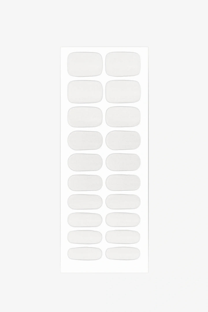 Full sheet of Clear Cat Eye gel nail wraps in glossy transparent tones with subtle shimmer, displayed in various sizes on a white background.