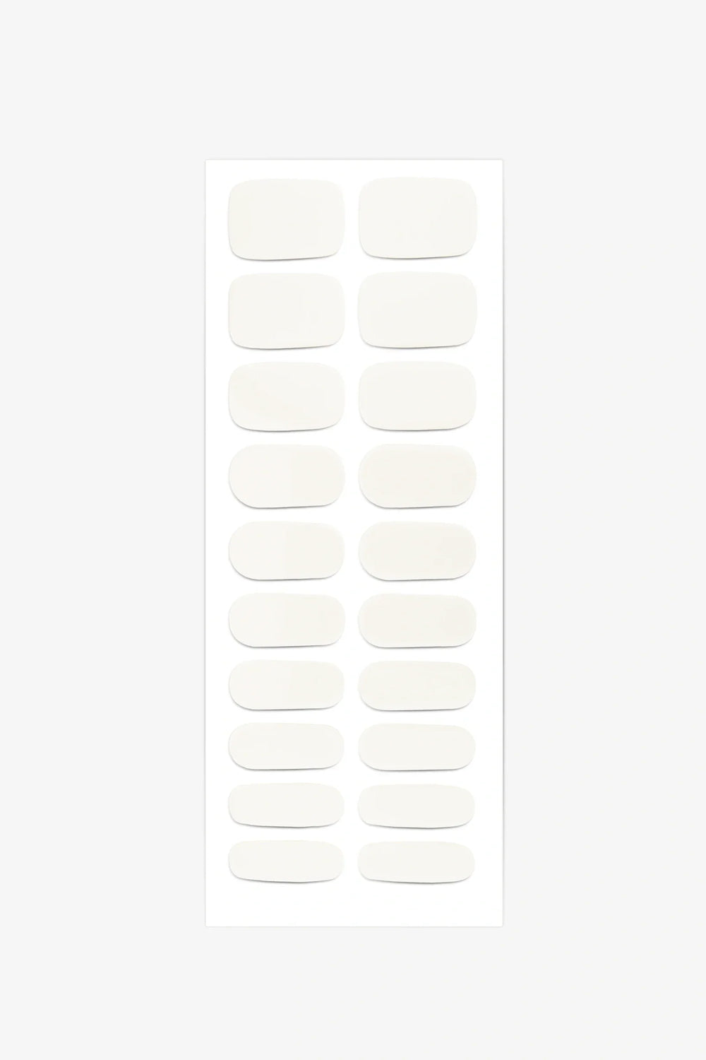 Full sheet of Creamy White semi-cured gel nail stickers displaying various sizes on a white background.