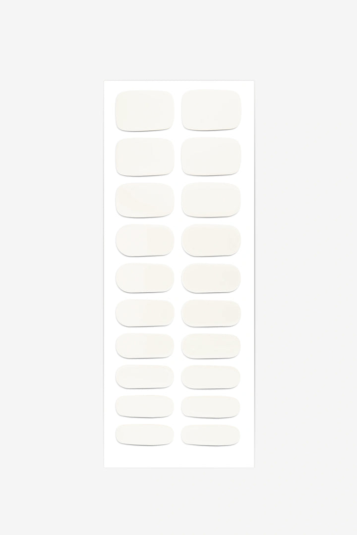 Full sheet of Creamy White semi-cured gel nail stickers displaying various sizes on a white background.