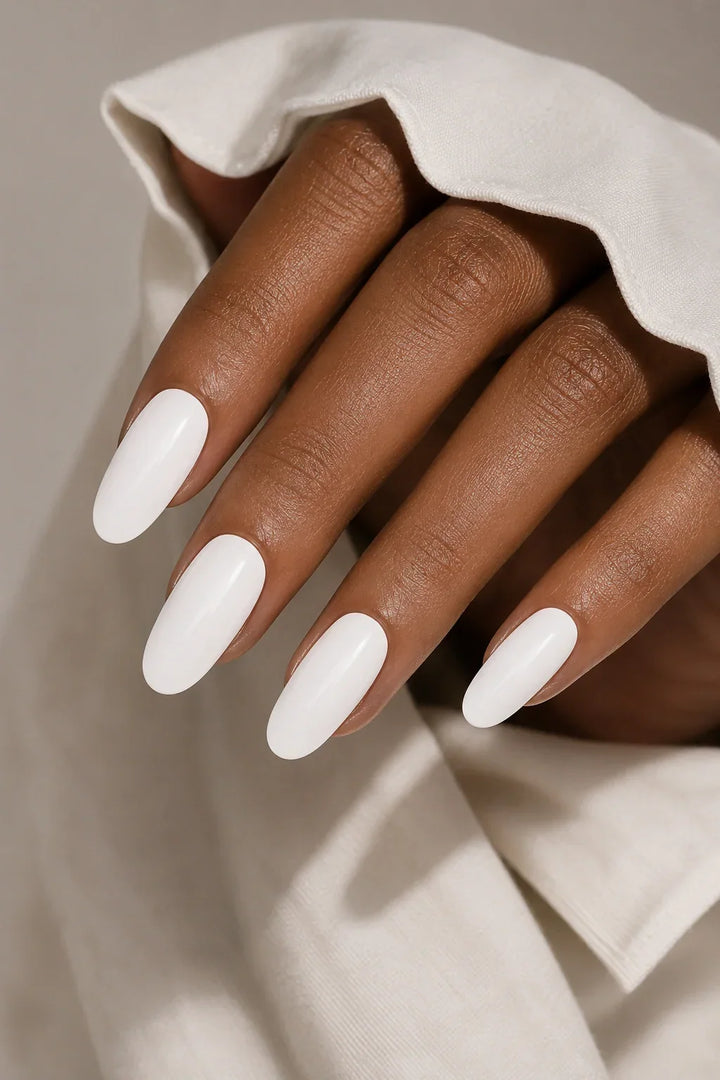 Crisp Cotton UV-free gel nail wraps in a bright white with a smooth glossy finish, shown on dark skin.