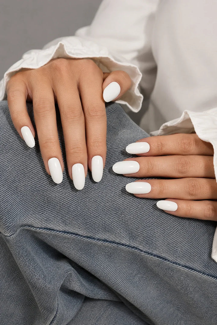 UV-free gel nail wraps in a crisp soft white with a smooth glossy finish, shown on light skin.