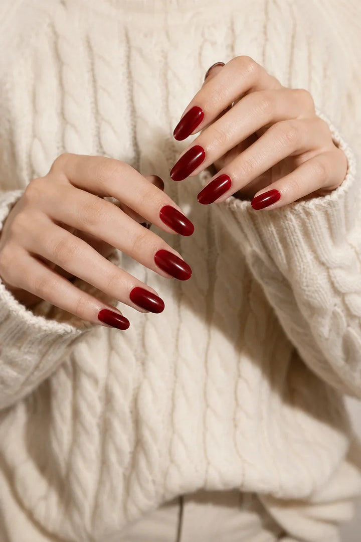 Dark Cherry Jam UV-free gel nail wraps in a rich translucent burgundy-red with cherry undertones and a glossy finish, shown on light skin.