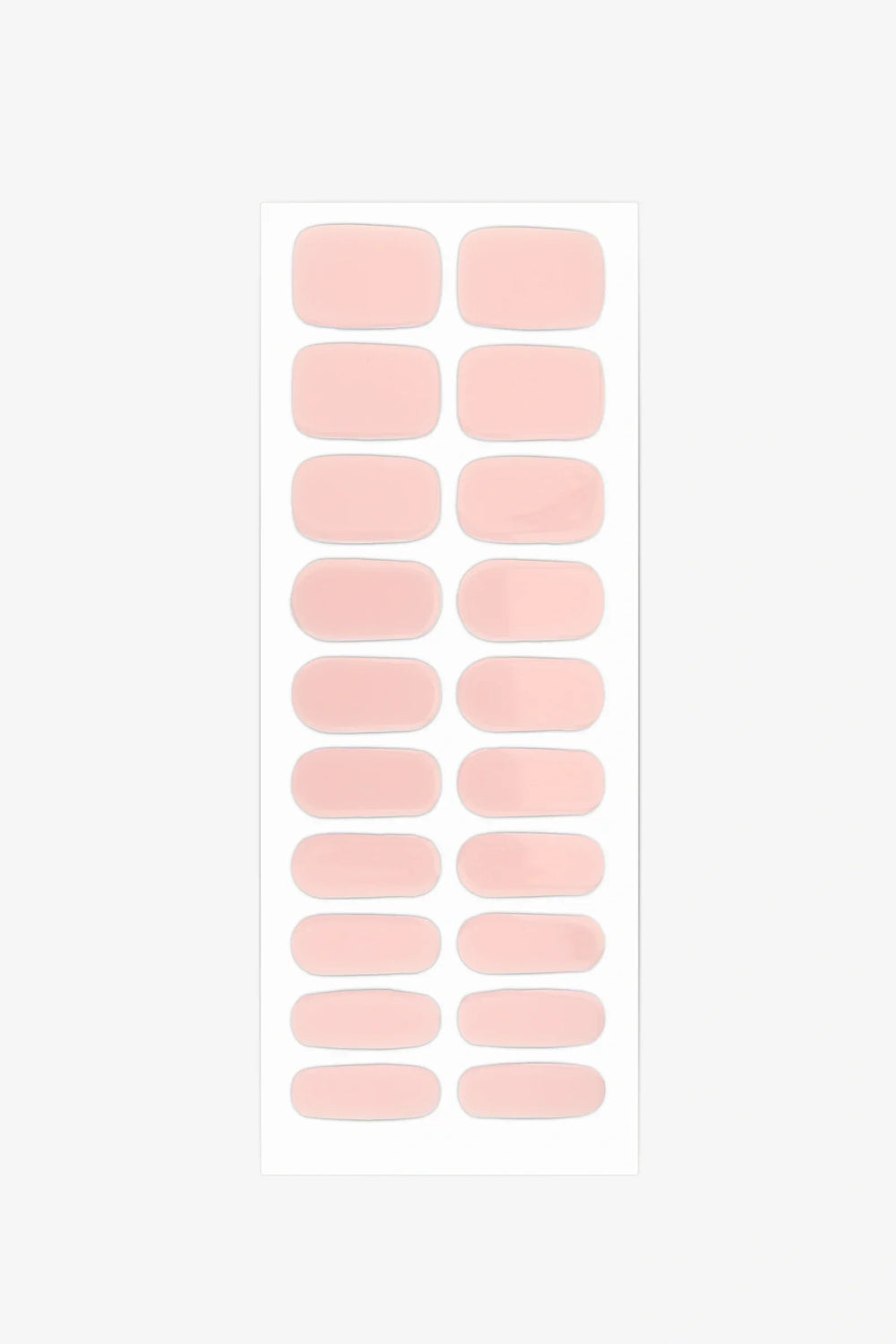 Full sheet of Dawn gel nail wraps in semi-transparent, blush pink with a soft rose tint and glossy finish, displayed in various sizes on a white background.