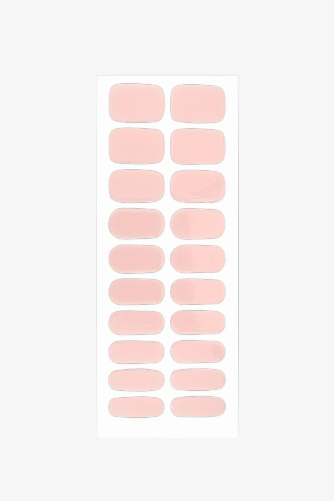Full sheet of Dawn gel nail wraps in semi-transparent, blush pink with a soft rose tint and glossy finish, displayed in various sizes on a white background.
