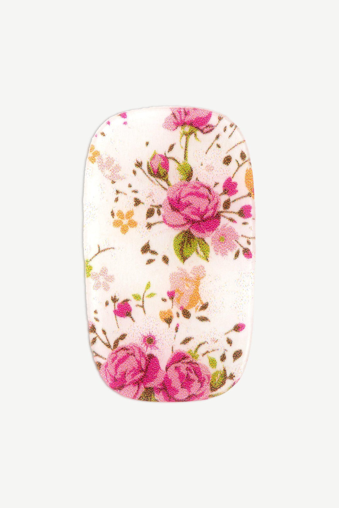 Macro image of a stick-on gel nail with sheer base and intricate pink and coral floral print with green leaves, glossy finish on white background.
