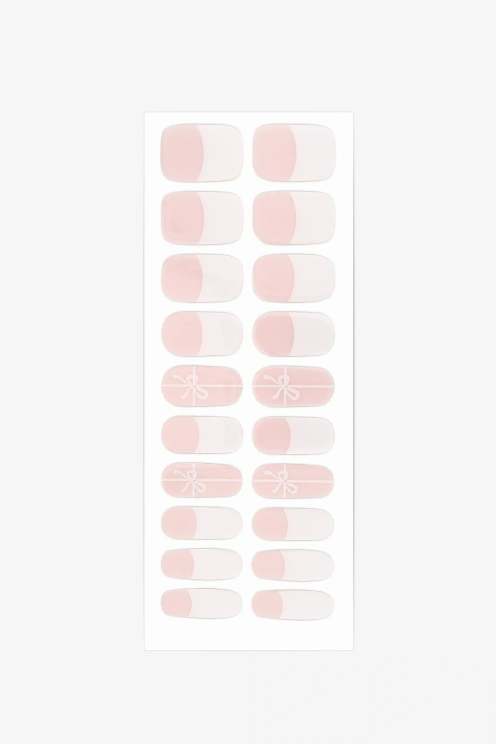 Sheet of semi-cured gel nail wraps with white-tipped and bow designs on translucent pink strips.