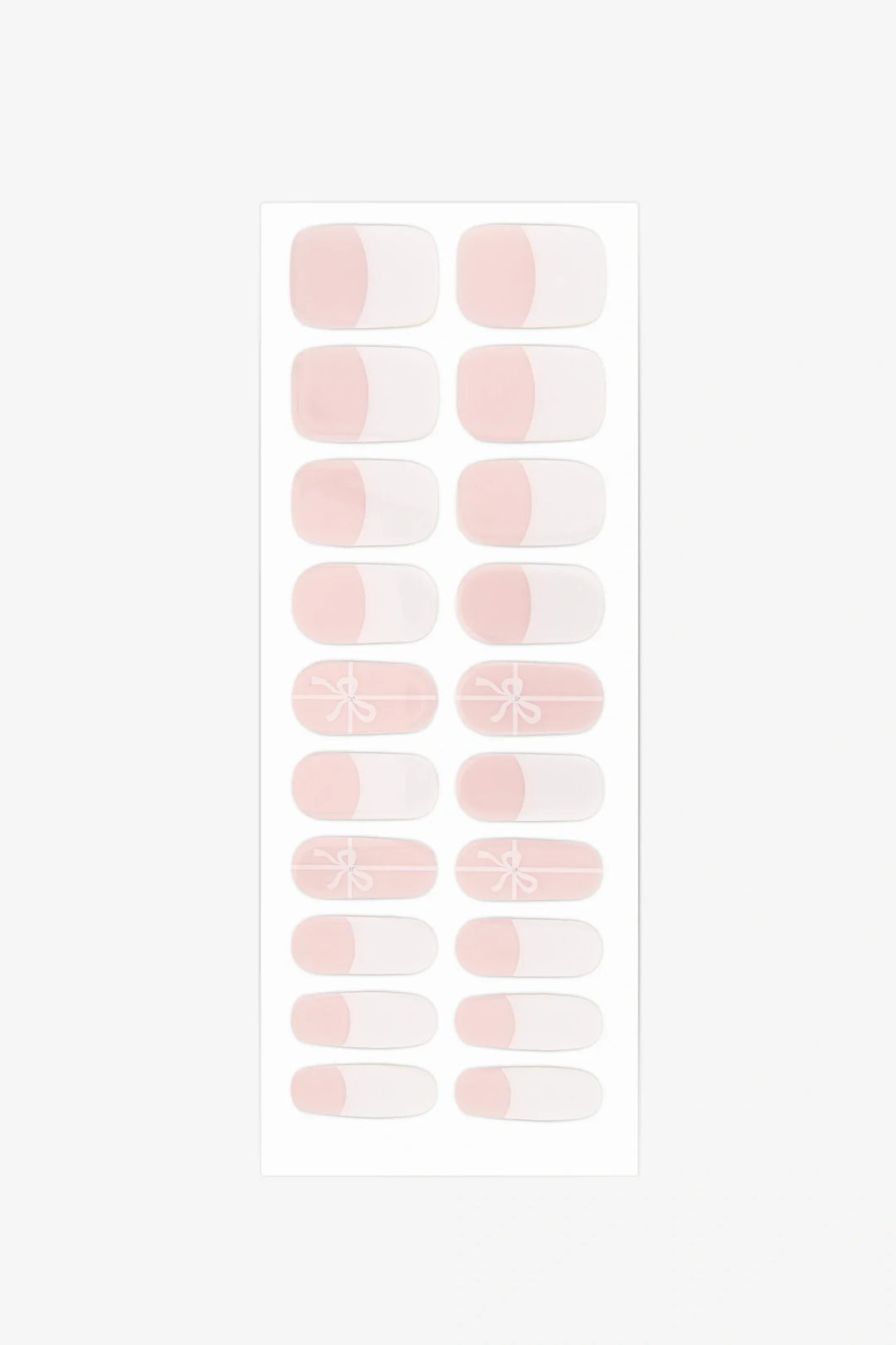 Sheet of semi-cured gel nail wraps with white-tipped and bow designs on translucent pink strips.