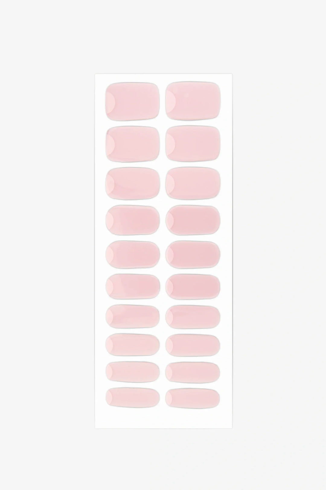 Sheet of Gelly French Moon semi-cured gel nail wraps showing milky pink strips with clean cuticle crescents for minimalist reverse-French manicures.