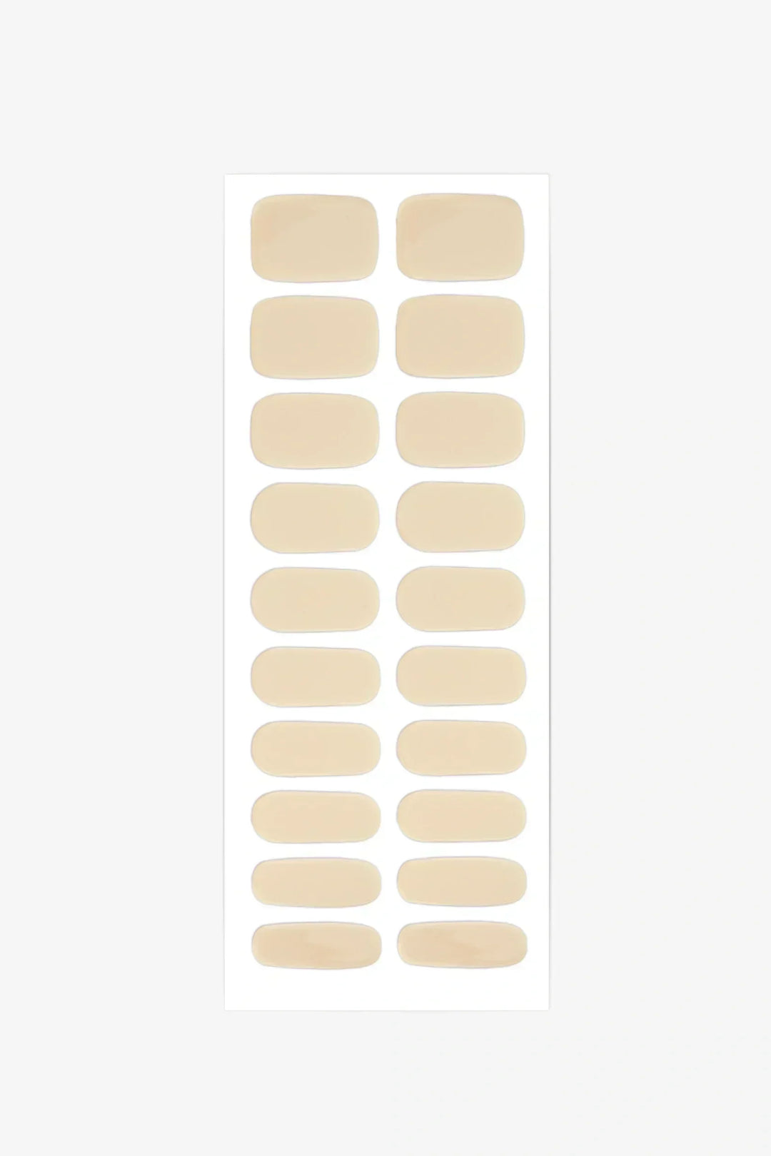 Sheet of semi-cured gel nail wraps in light pastel-yellow tones with a smooth, glossy finish.