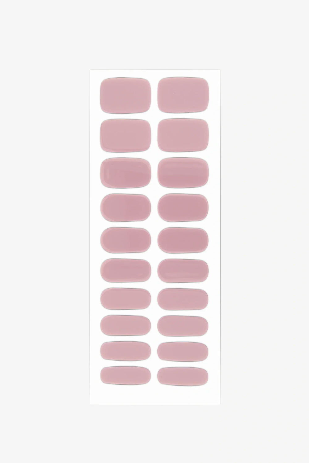Sheet of semi-cured gel nail wraps in muted mauve-pink shades with a creamy, high-gloss surface.
