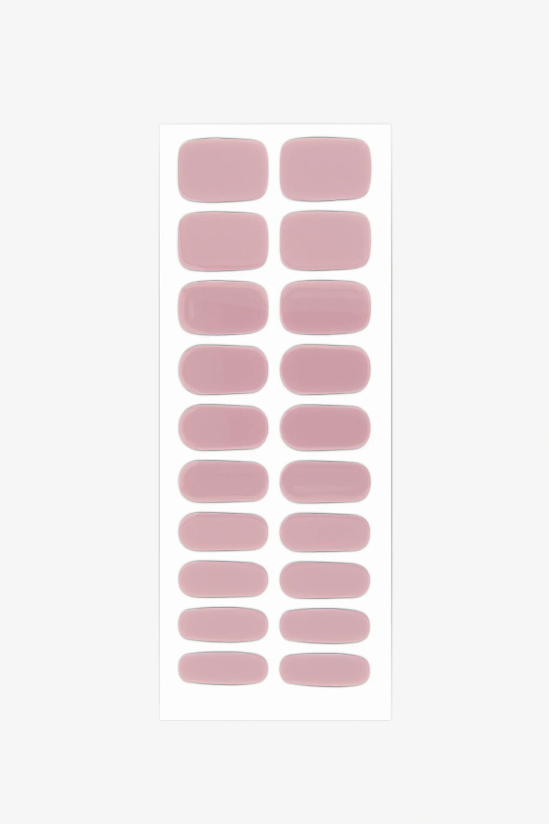 Sheet of semi-cured gel nail wraps in muted mauve-pink shades with a creamy, high-gloss surface.