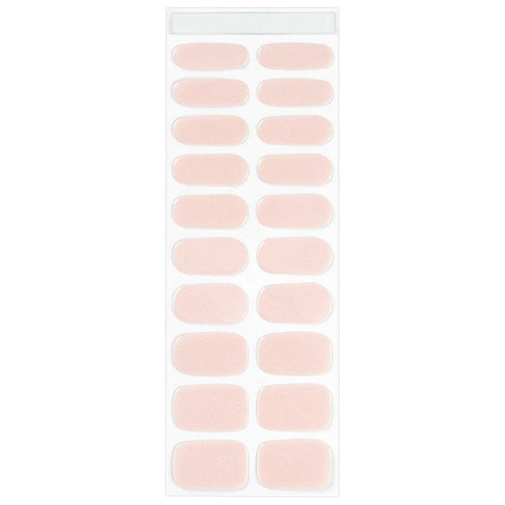 Sheet of natural beige gel nail strips with a blush nude tone and glossy finish.