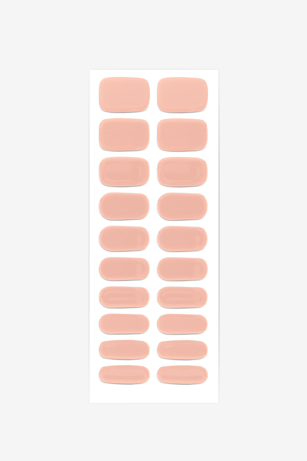 Full sheet of Nude Peach semi-cured gel nail stickers displaying various sizes on a white background.