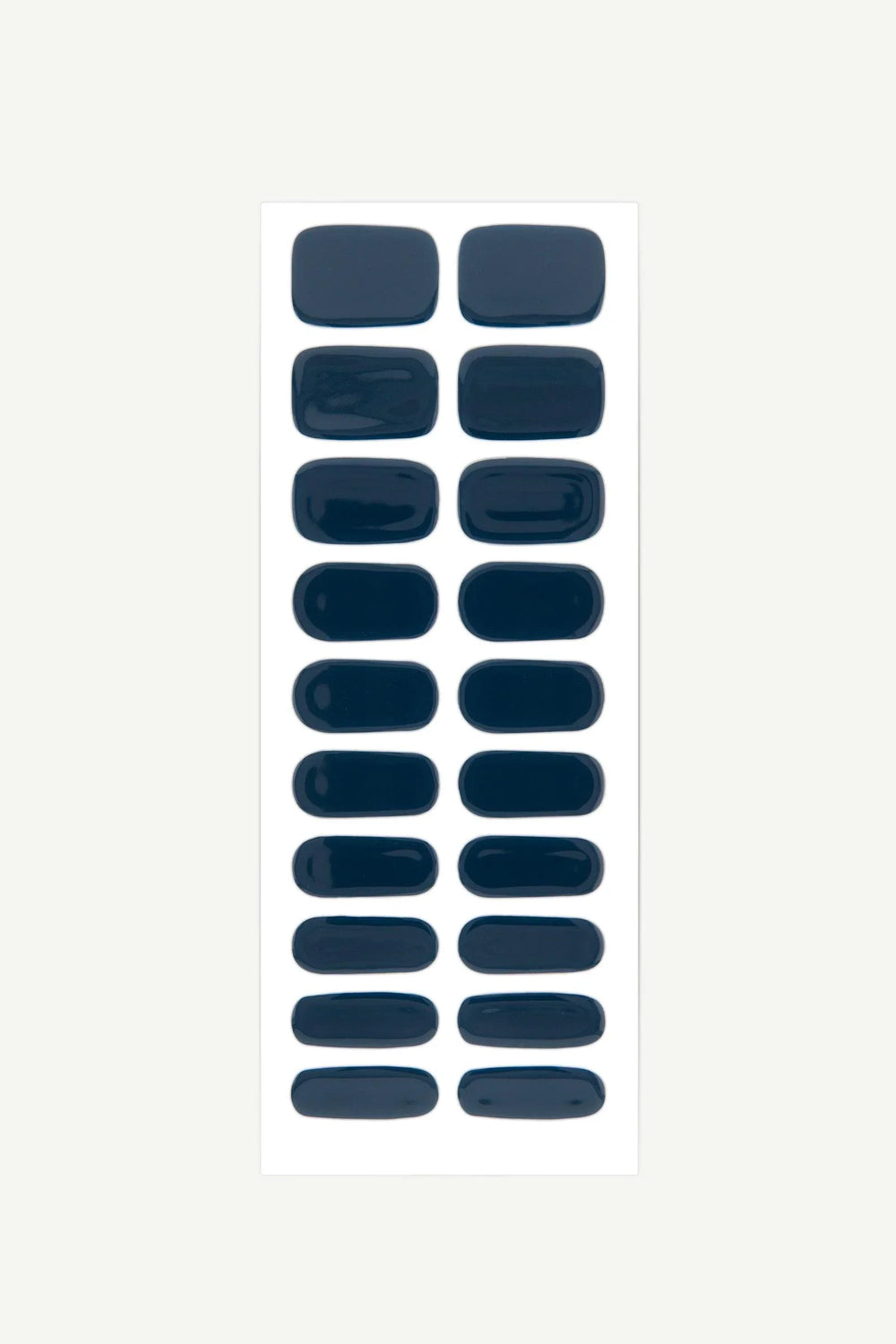 Sheet of dark navy blue semi-cured gel nail wraps with glossy finish.