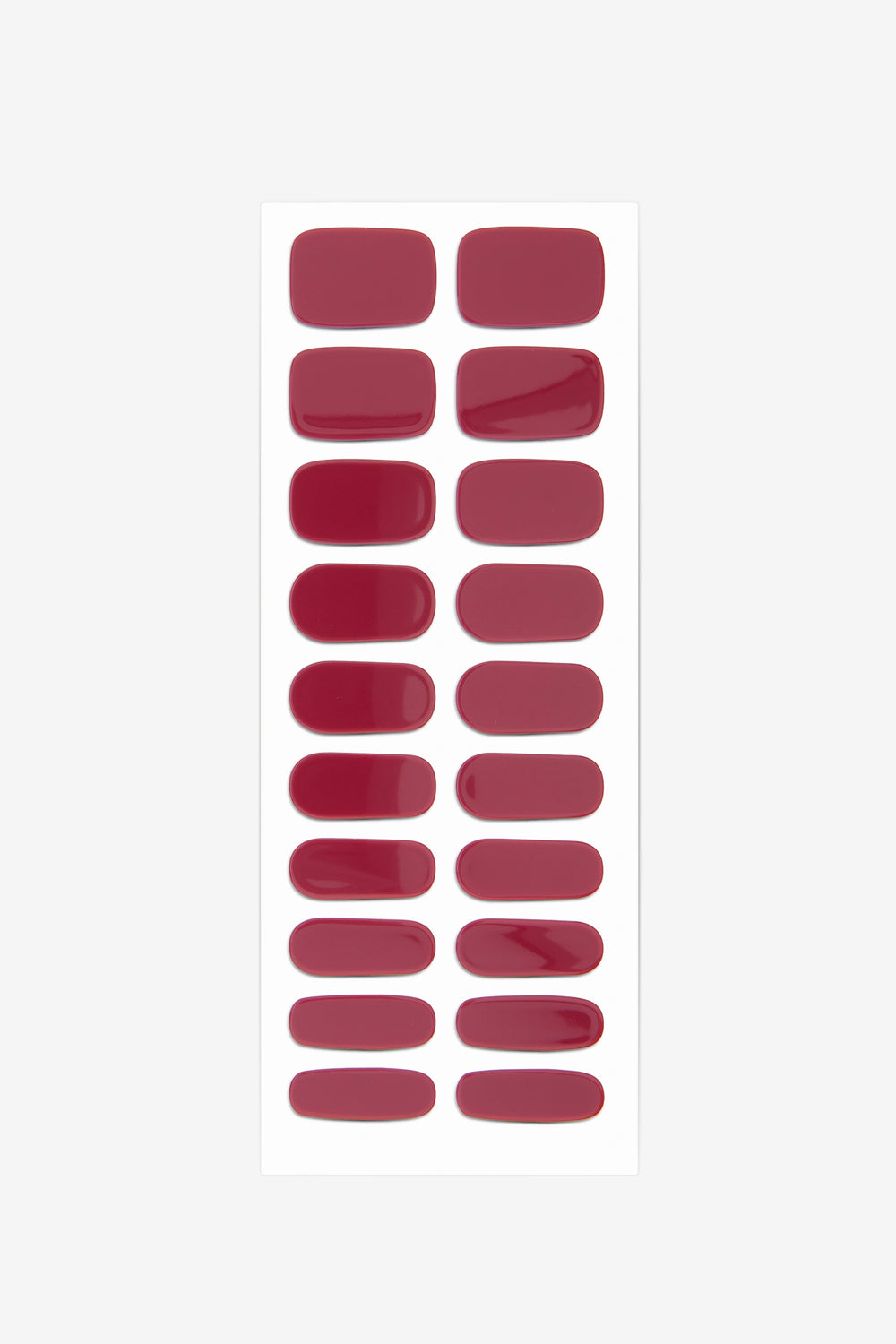 Full sheet of Oxblood red semi-cured gel nail stickers displaying various sizes on a white background.