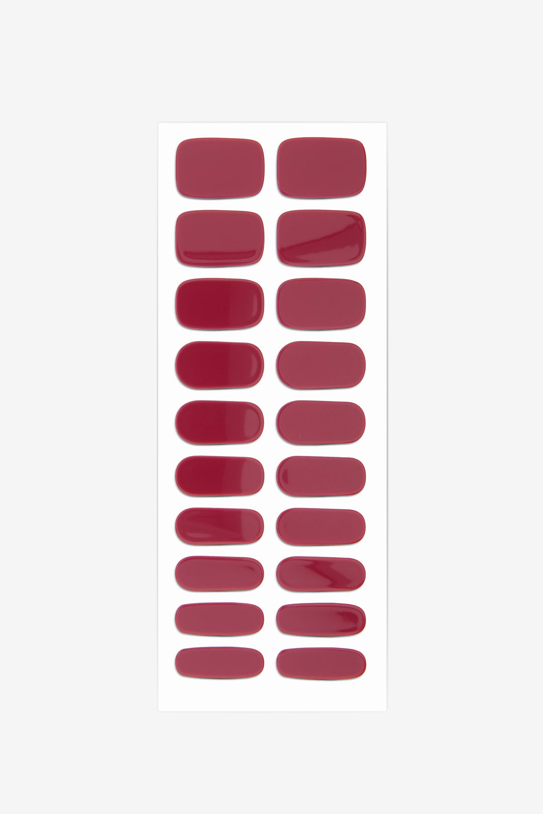 Full sheet of Oxblood red semi-cured gel nail stickers displaying various sizes on a white background.