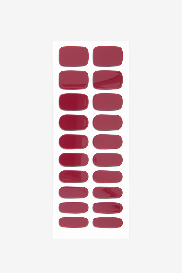 Full sheet of Oxblood red semi-cured gel nail stickers displaying various sizes on a white background.