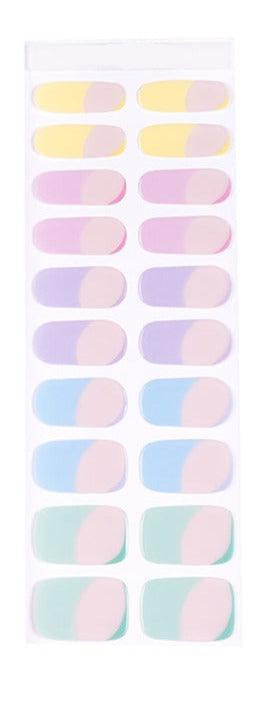 Sheet of pastel rainbow gel nail stickers featuring nude, sheer tones with multicolor gradients in pink, blue, yellow, and lilac.