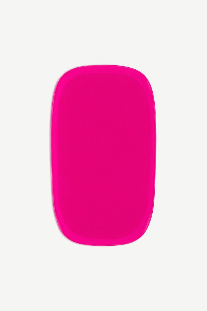 A macro image of a single stick-on rich mauve stick-on gel nail strip showing deep magenta tone and smooth glossy texture.